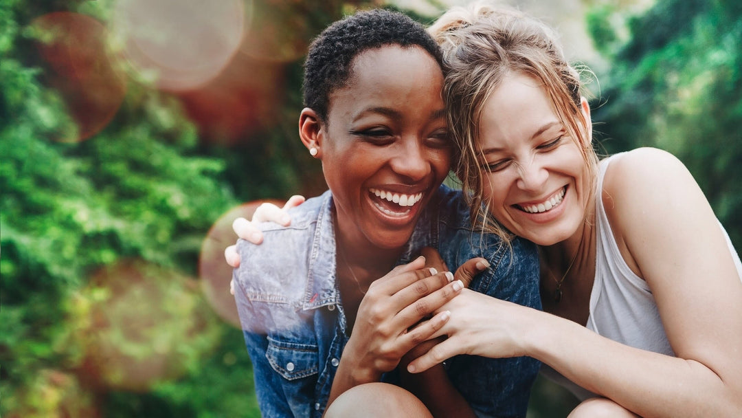 two women laughing together