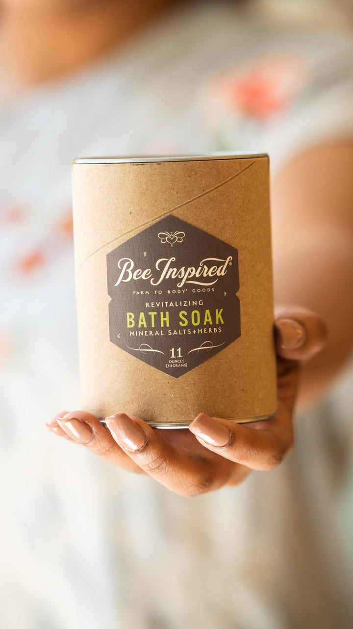 Revitalizing bath soak in hand 