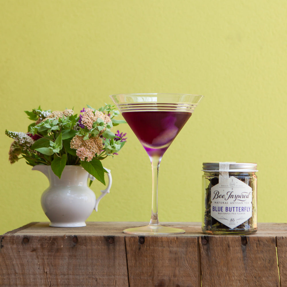 Blue Butterfly Peaflower Tea with flowers and martini glass