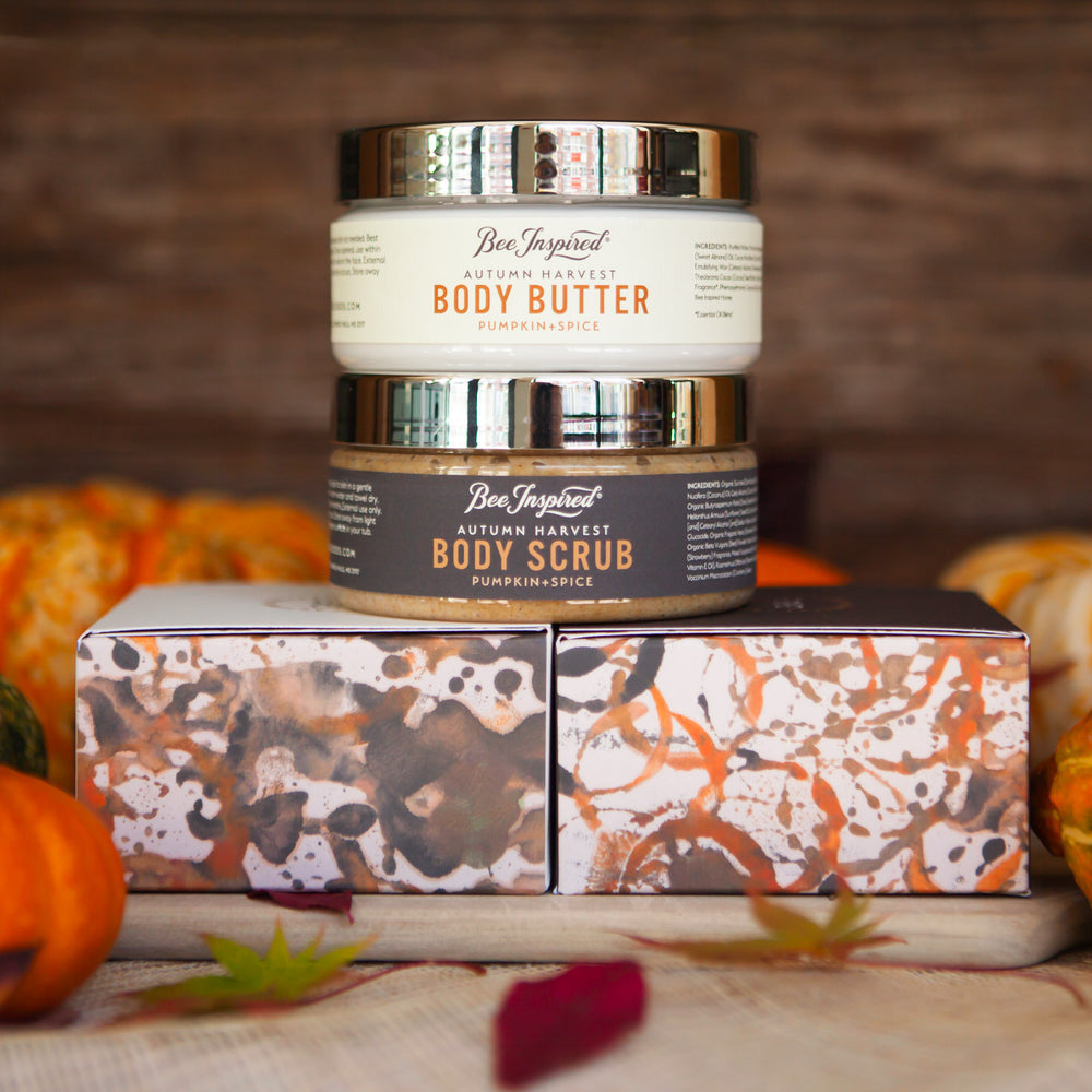 Autumn Harvest butter and scrub duo on boxes with pumpkins 