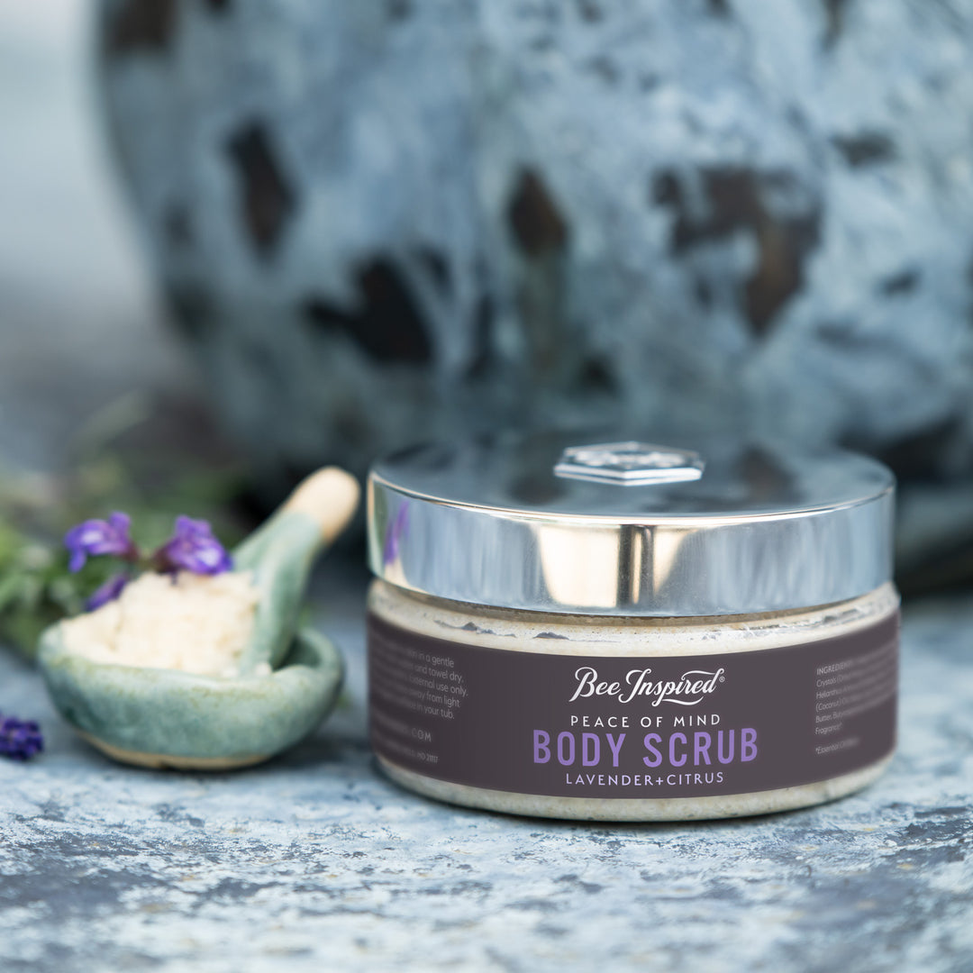 peace body scrub with a mixing bowl and lavender