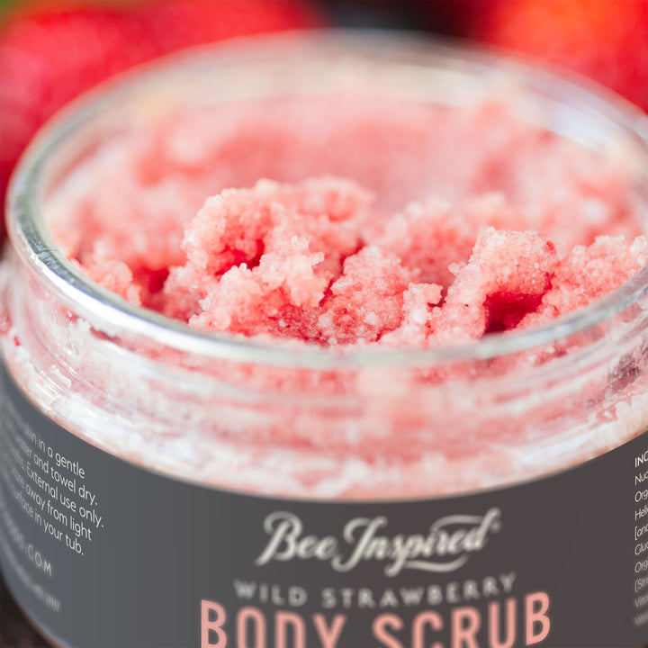 close up of an open container of wild strawberry body scrub from bee inspired honey retail store in owings mills