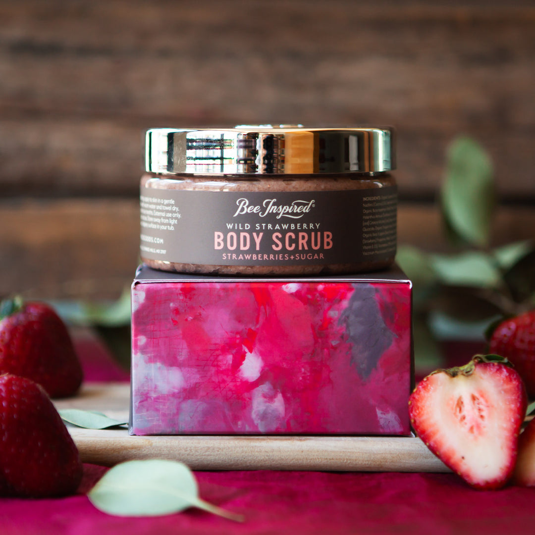 Wild Strawberry body scrub and box with fresh strawberries 