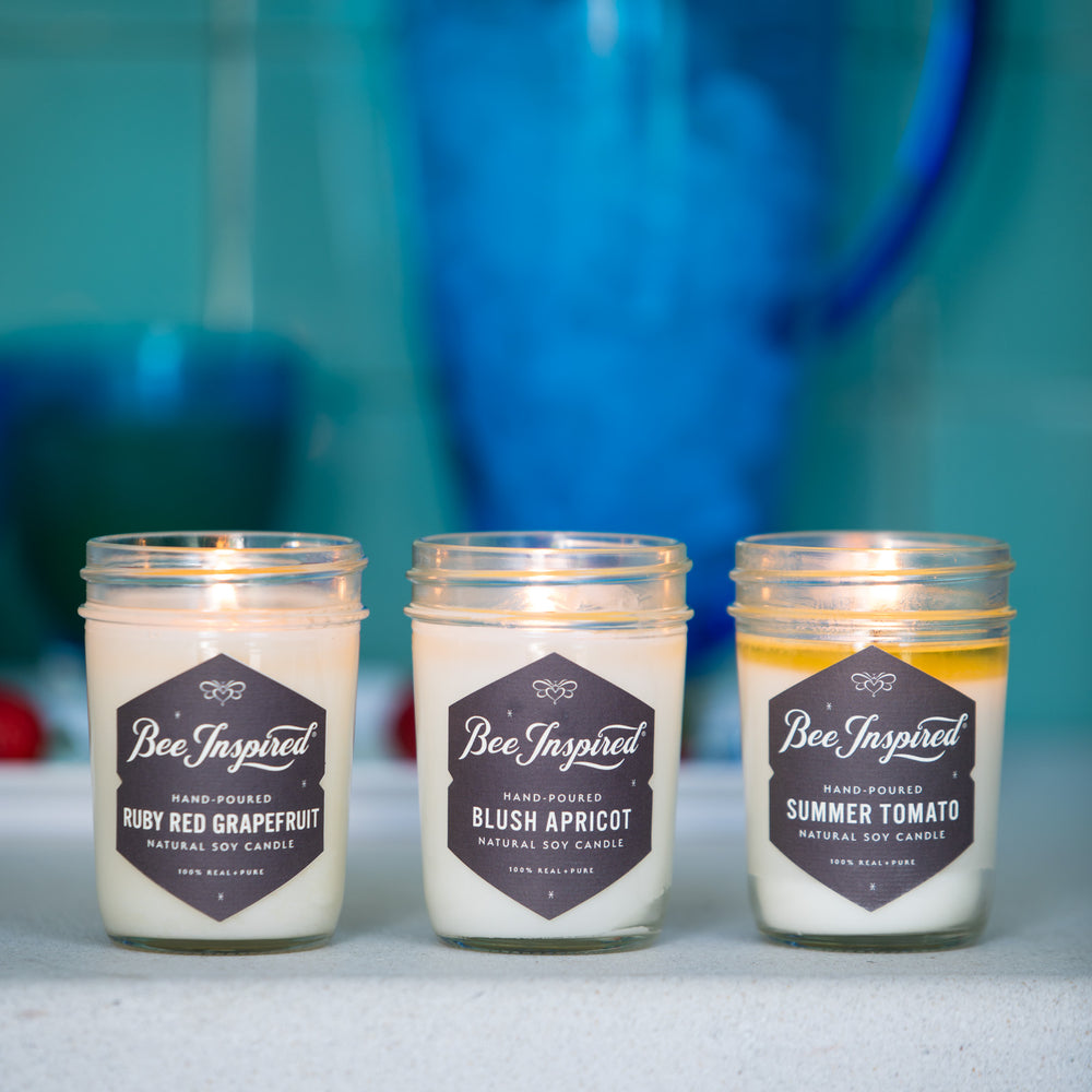 Summer jelly jar candle set burning in bathroom 