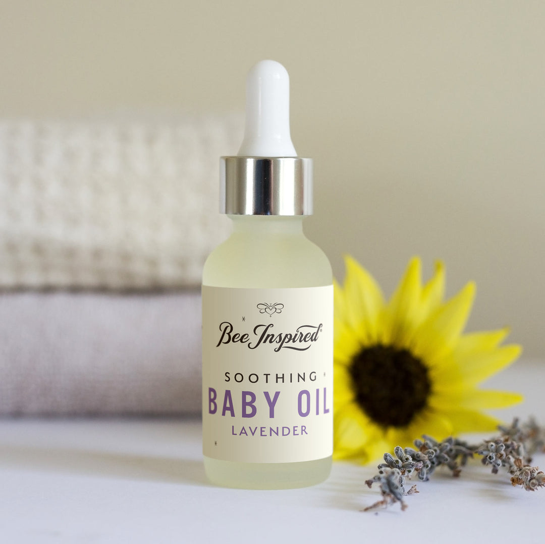 lavender baby oil with a yellow flower and lavender 