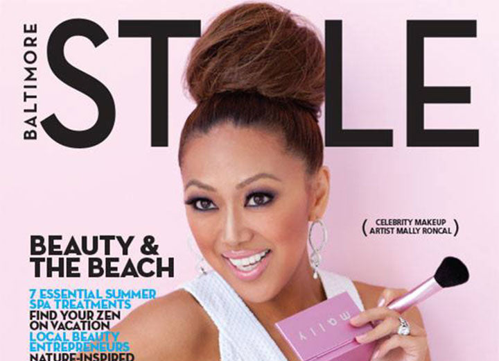 Cover of Baltimore Style magazine with woman holding makeup 