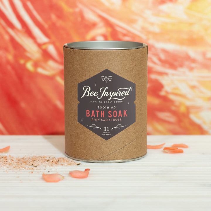 Soothing bath soak in front of orange and red art 