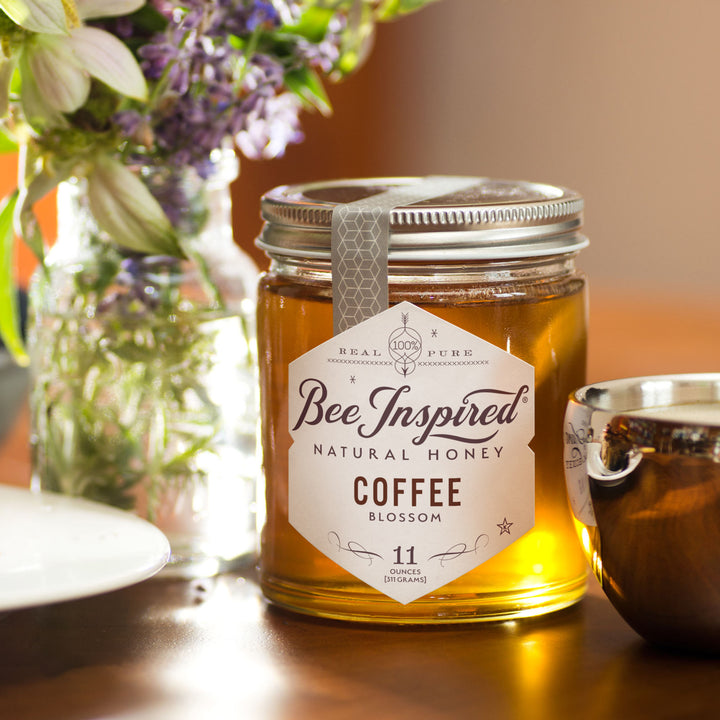 Coffee honey with vase of flowers 