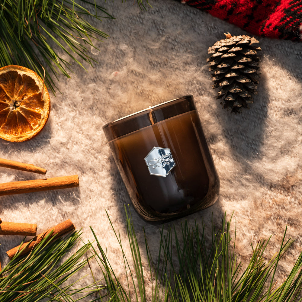 Winter Forest luxe candle flat lay with winter decorations 