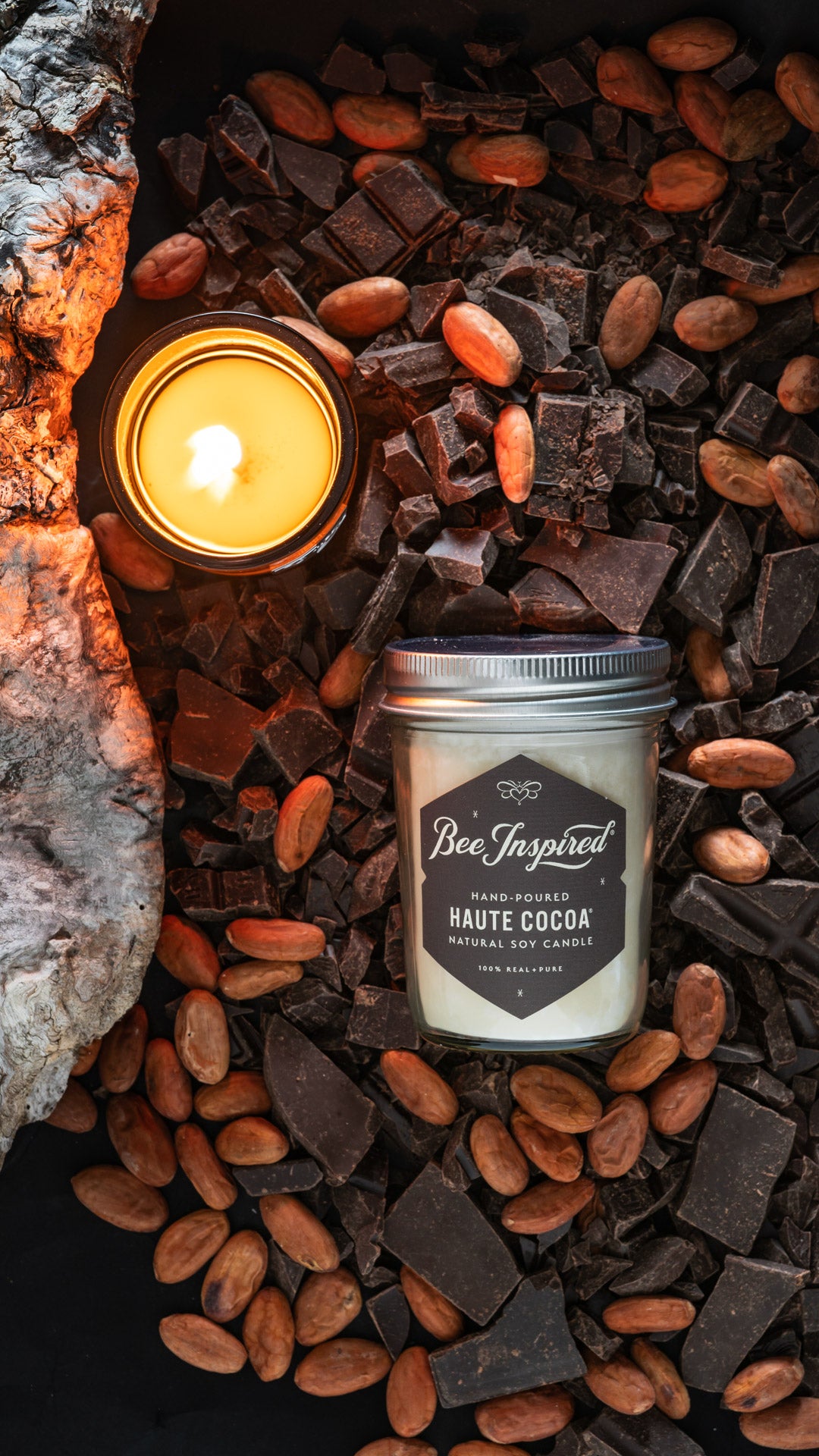 Haute Cocoa jelly jar candle flat lay with chocolate and almonds 