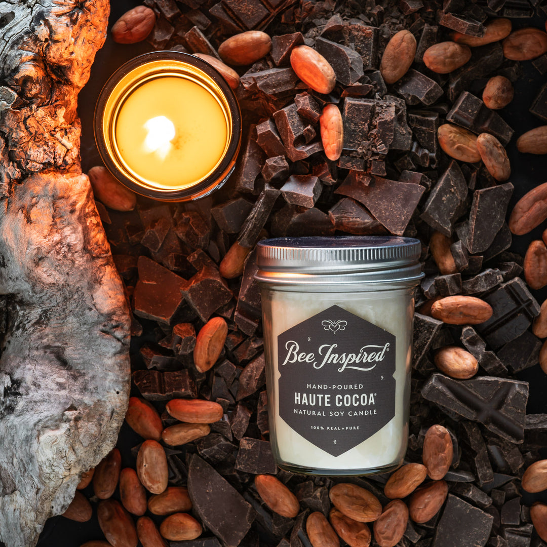 Haute Cocoa jelly jar candle flat lay with chocolate and almonds 