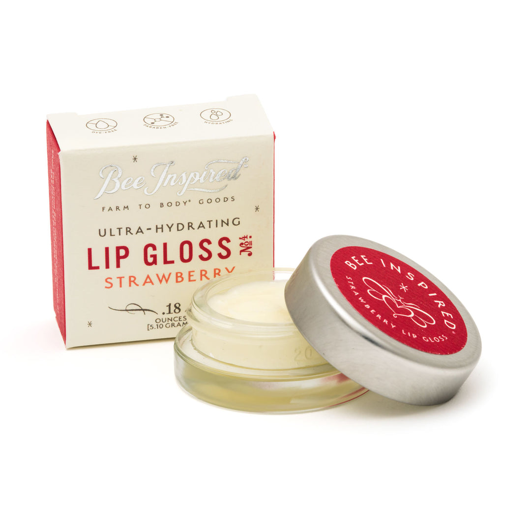 Strawberry lip gloss and box on white 