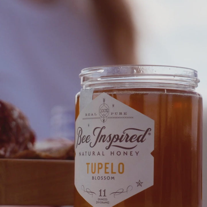 haley on a yacht with a jar of tupelo honey from bee inspired honey retail store in owings mills