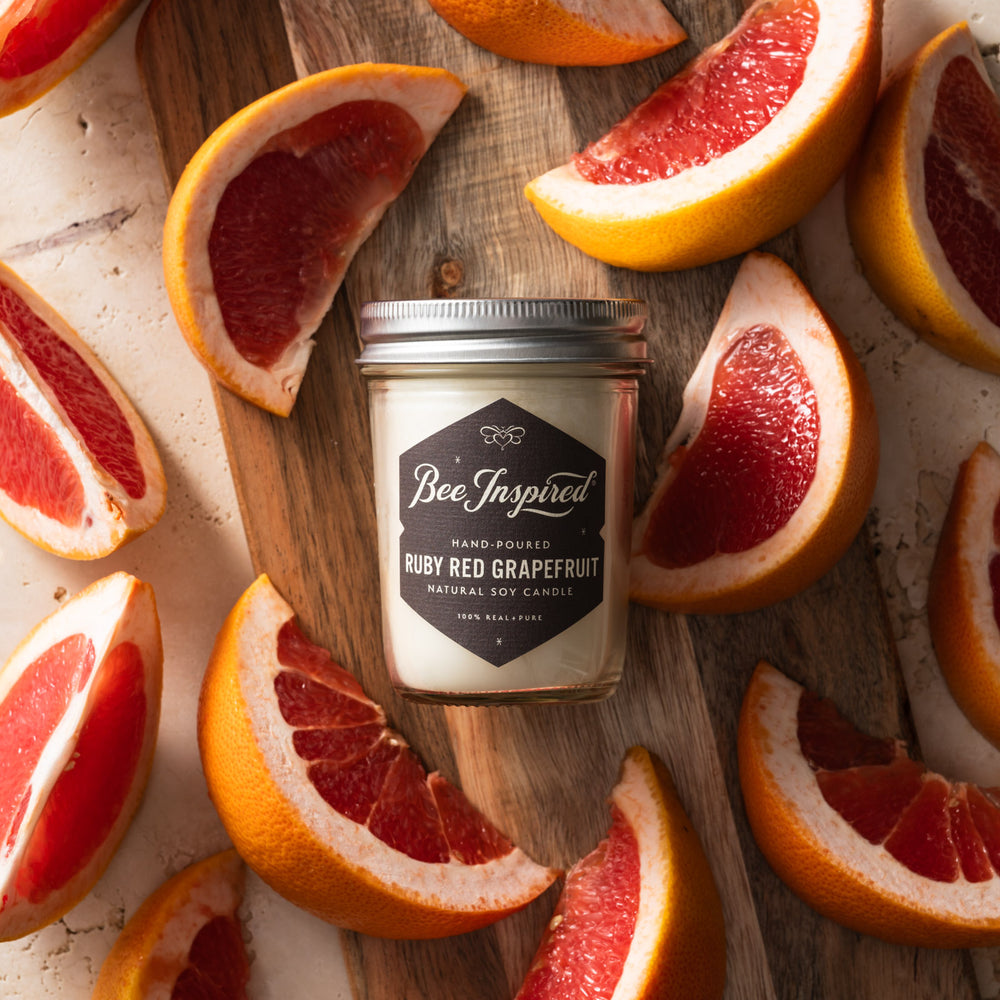 Ruby Red Grapefruit jelly jar candle flat lay with grapefruit slices 