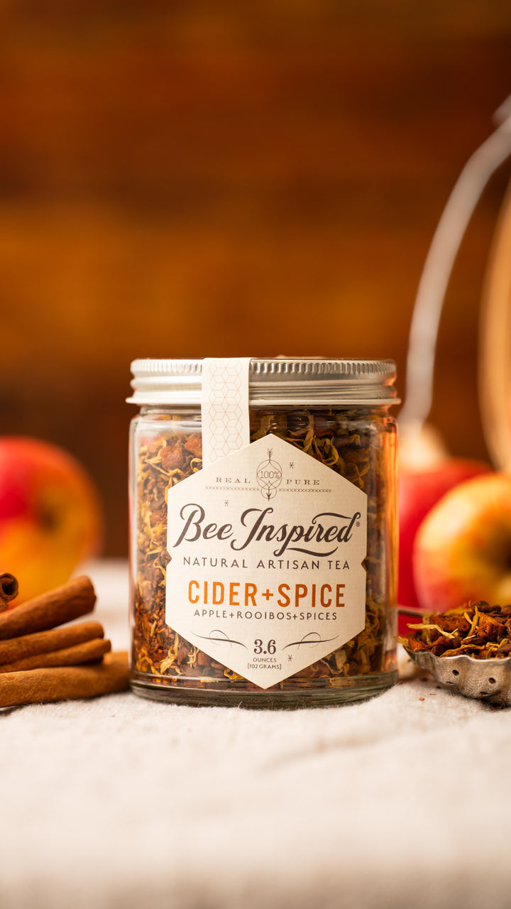 Cider and Spice Tea with cinnamon sticks and apples 