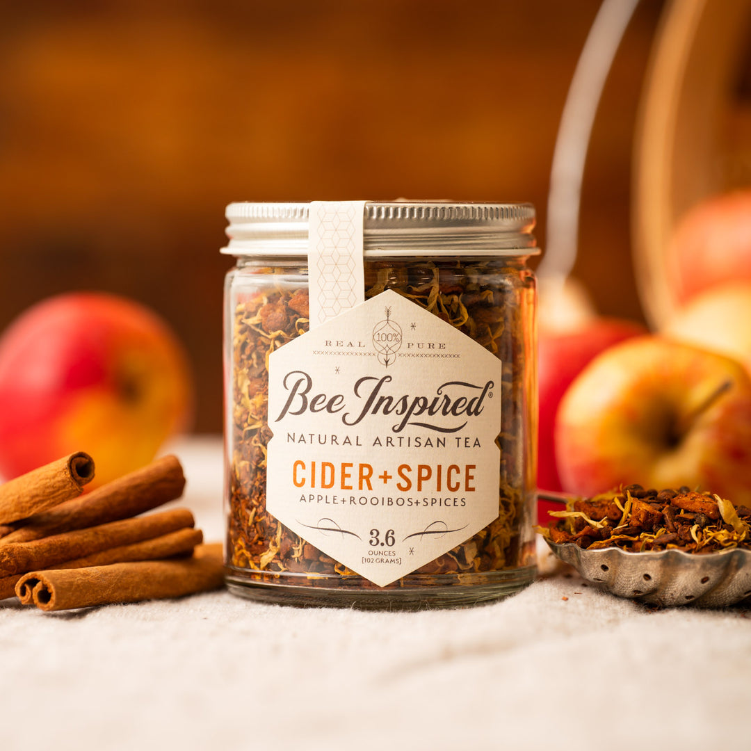 Cider and Spice Tea with cinnamon sticks and apples 