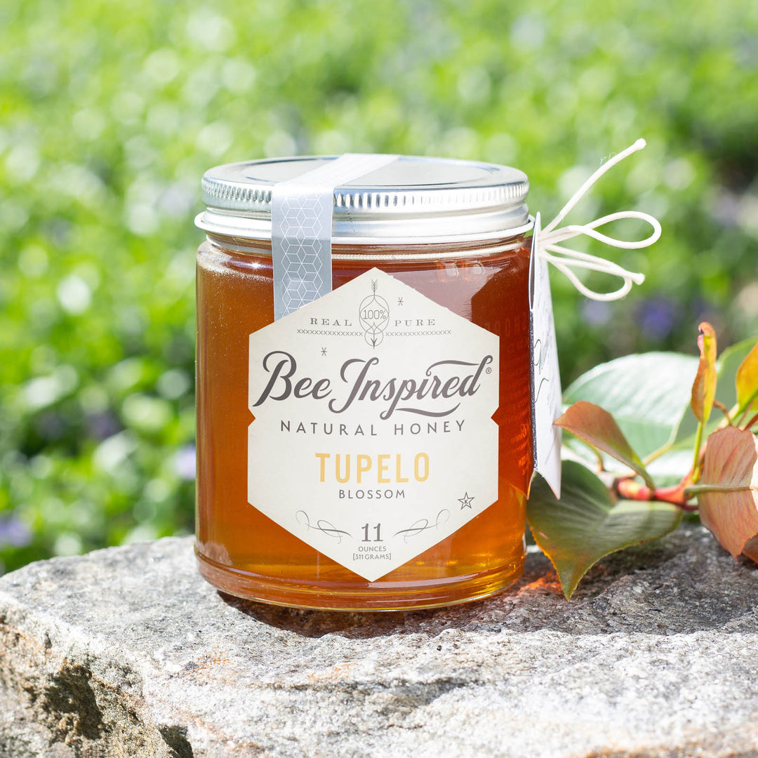 Tupelo honey on stone in front of field 